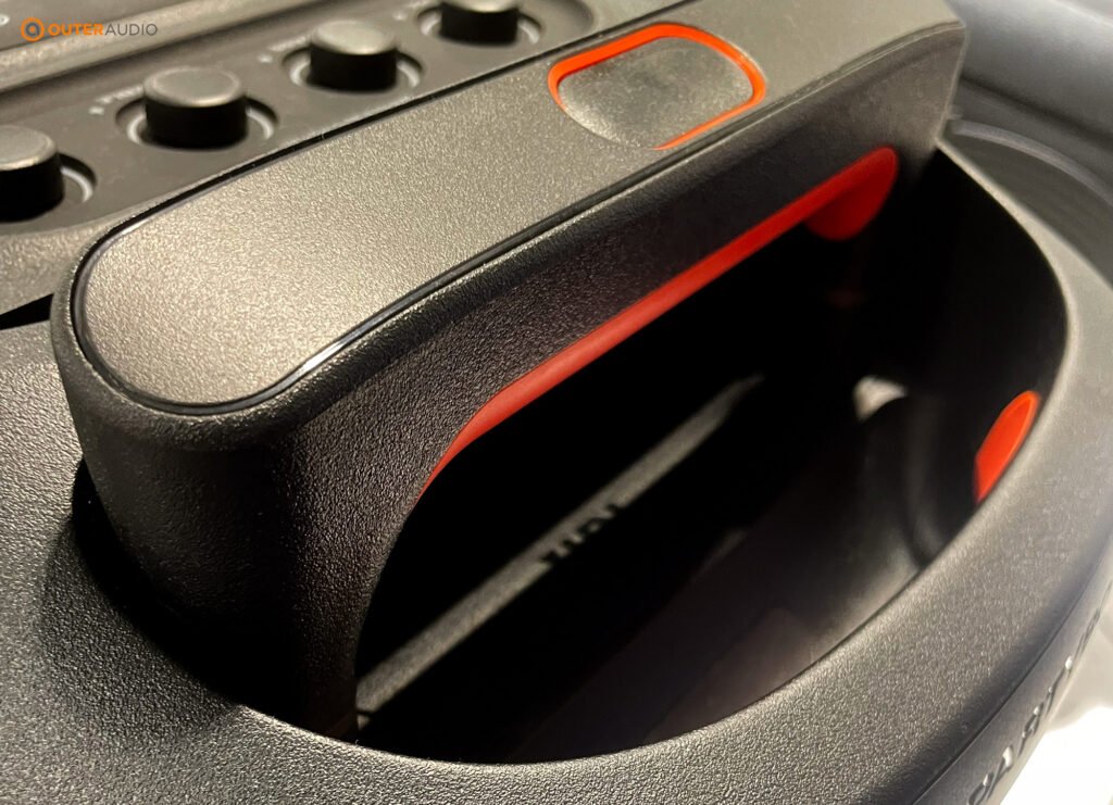 Telescopic handle of the PartyBox 320, slightly extended from the top of the speaker