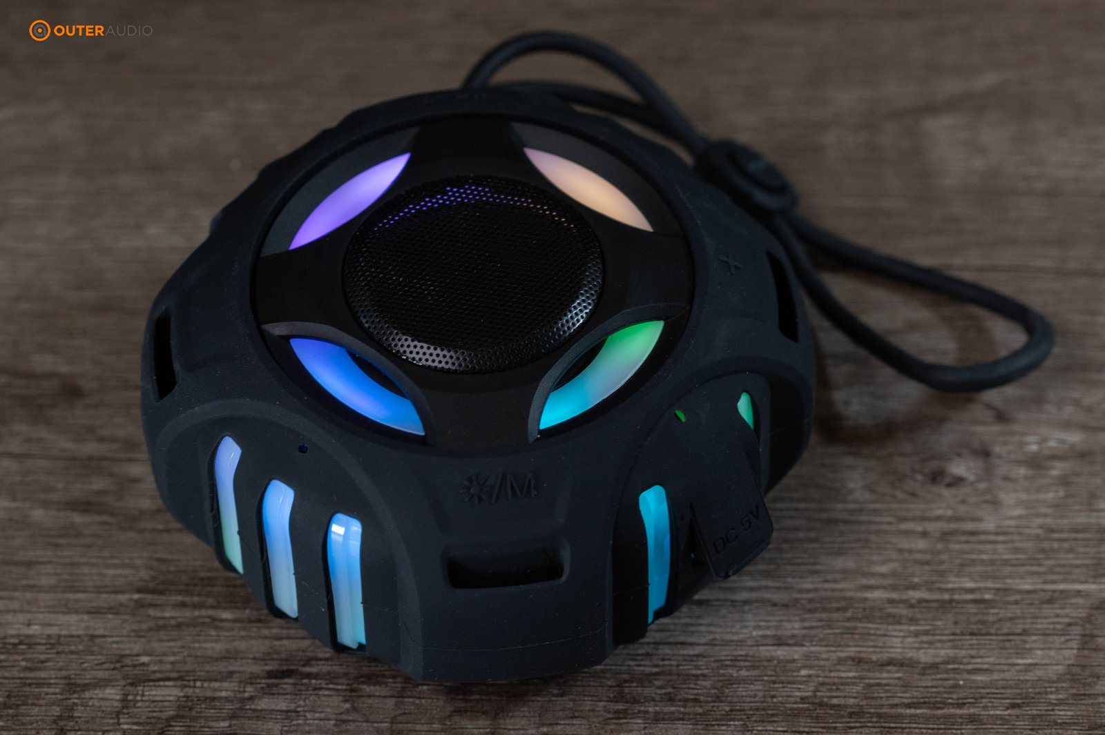 Comiso shower speaker sitting on desk