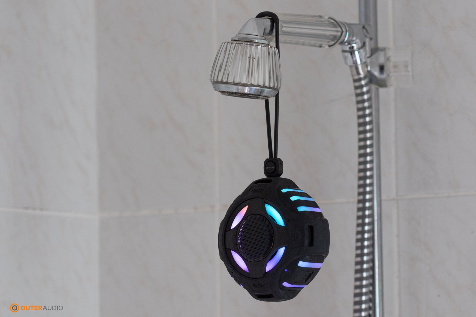 Comiso shower speaker hanging from shower head