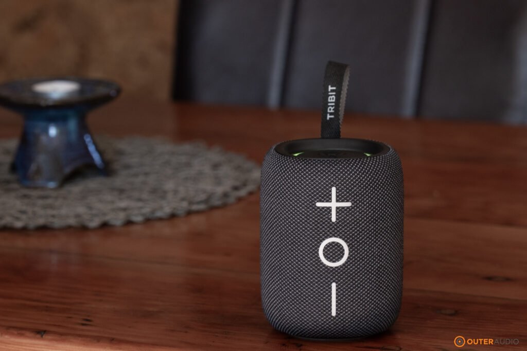Tribit Stormbox Mini Plus placed on a wooden table